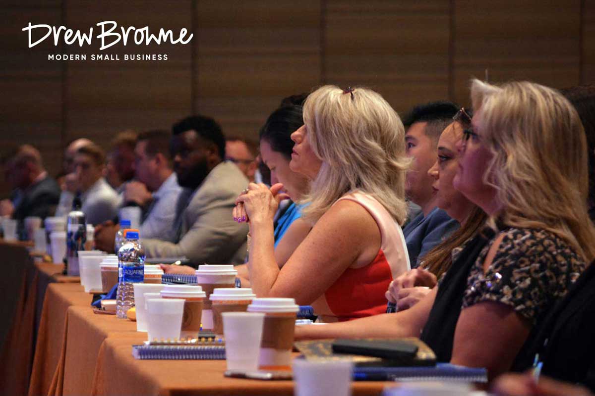 audience members listening attentively to a business speaker