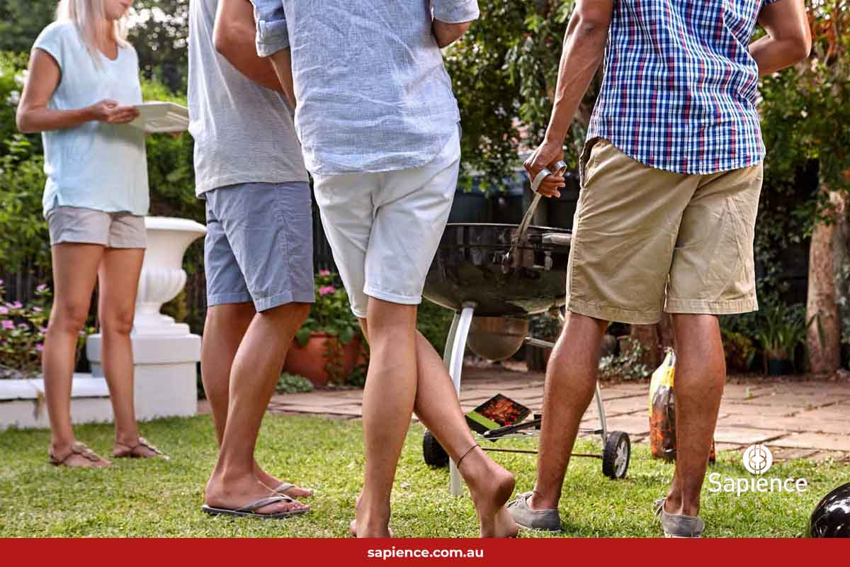friends standing at a BBQ