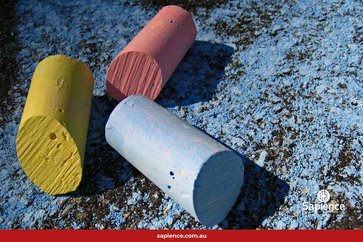 broken pierces of chalk on floor