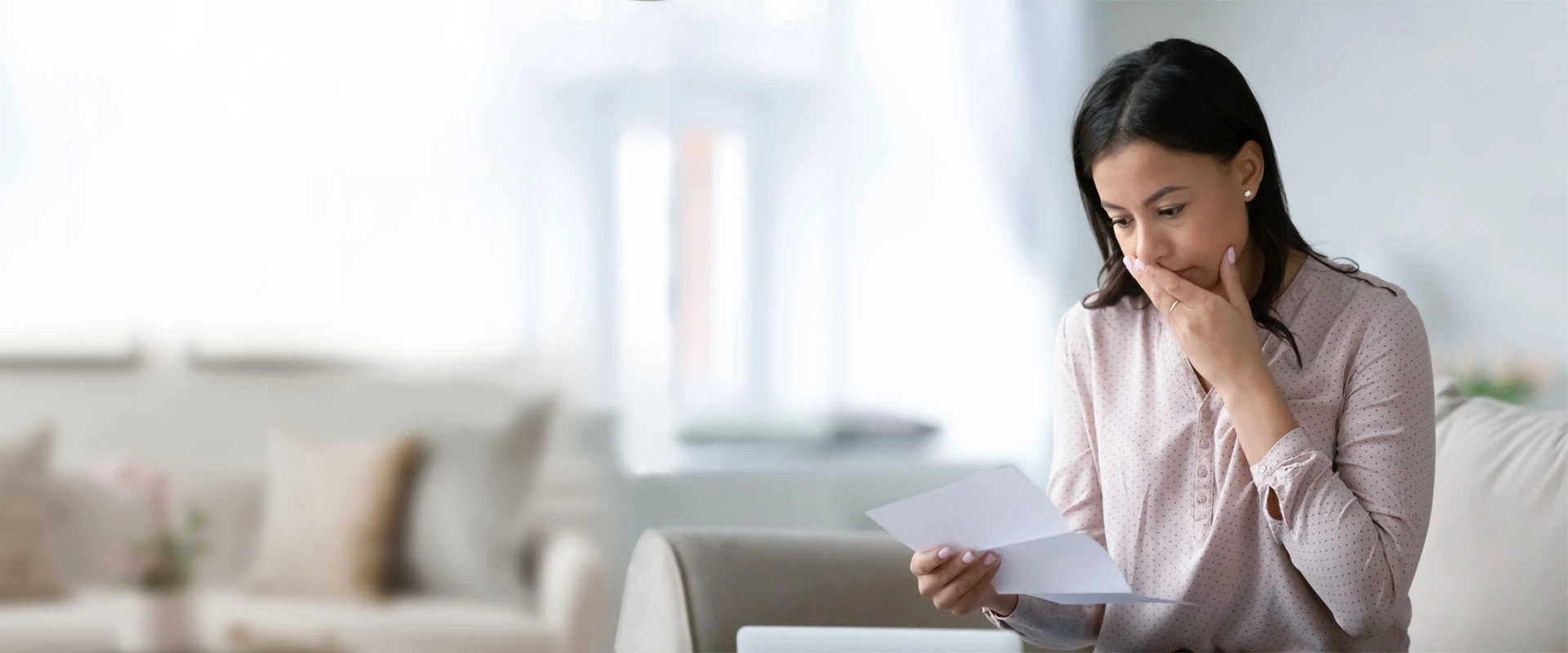 concerned person reading a letter with life changing news