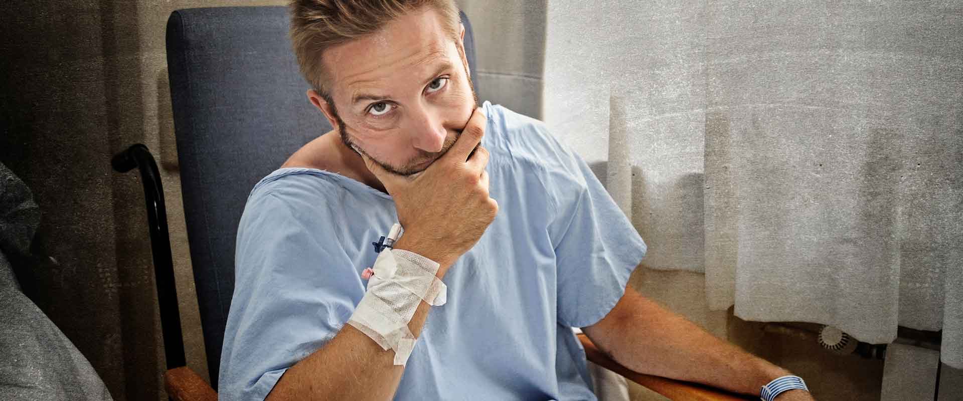 business owner looking at the camera from the hospital emergency room