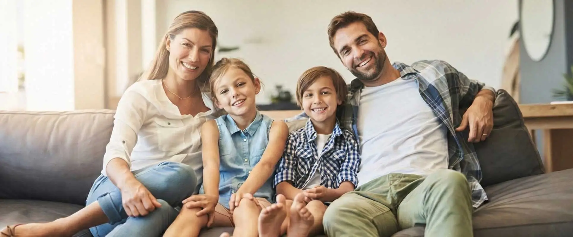 happy blended family relaxing on the couch together
