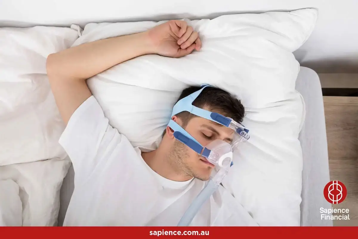 Attractive male sleeping with white tee-shirt with CPAP mask
