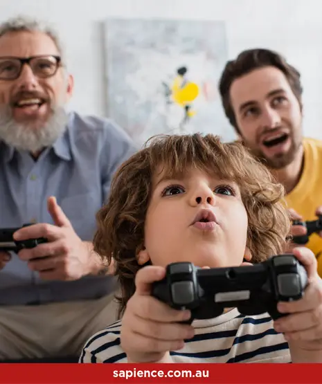 three generations of happy men playing video games together