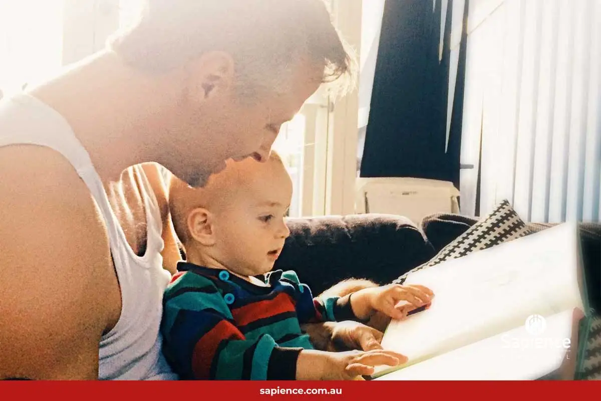 grandfather and grandchild reading together